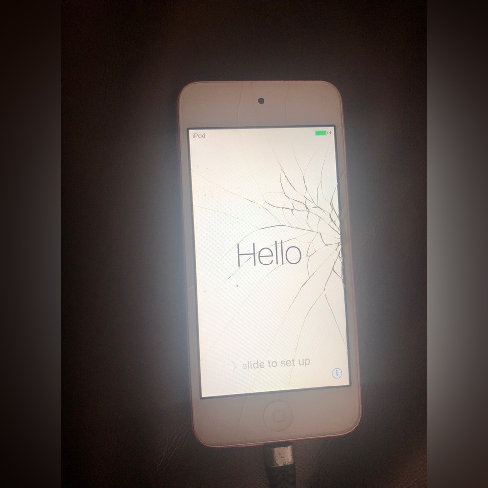 Hand hold used pink apple iPod touch 5th generation